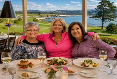 Three women enjoying a luxury coastal lunch overlo...